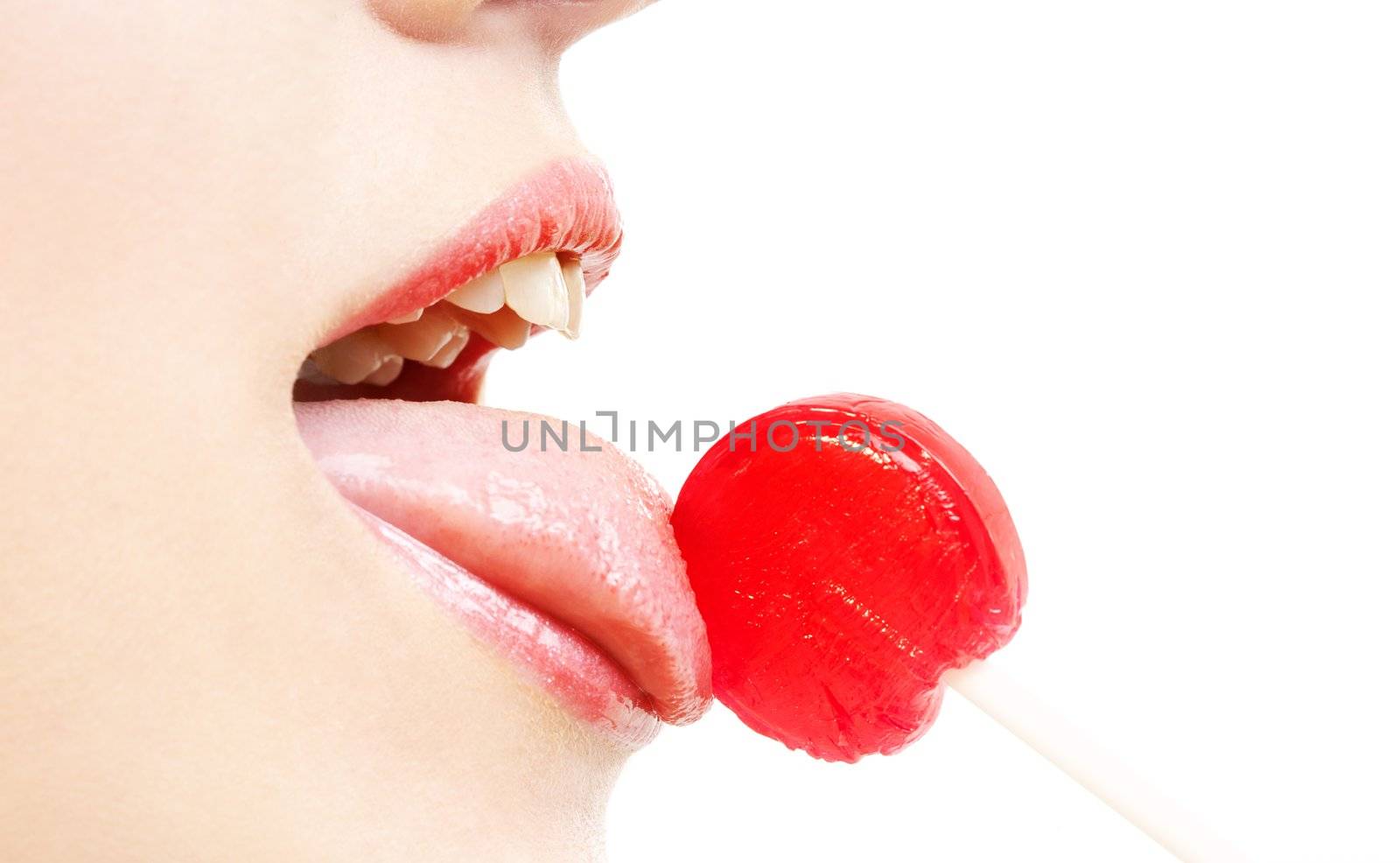 picture of lips, tongue and candy over white