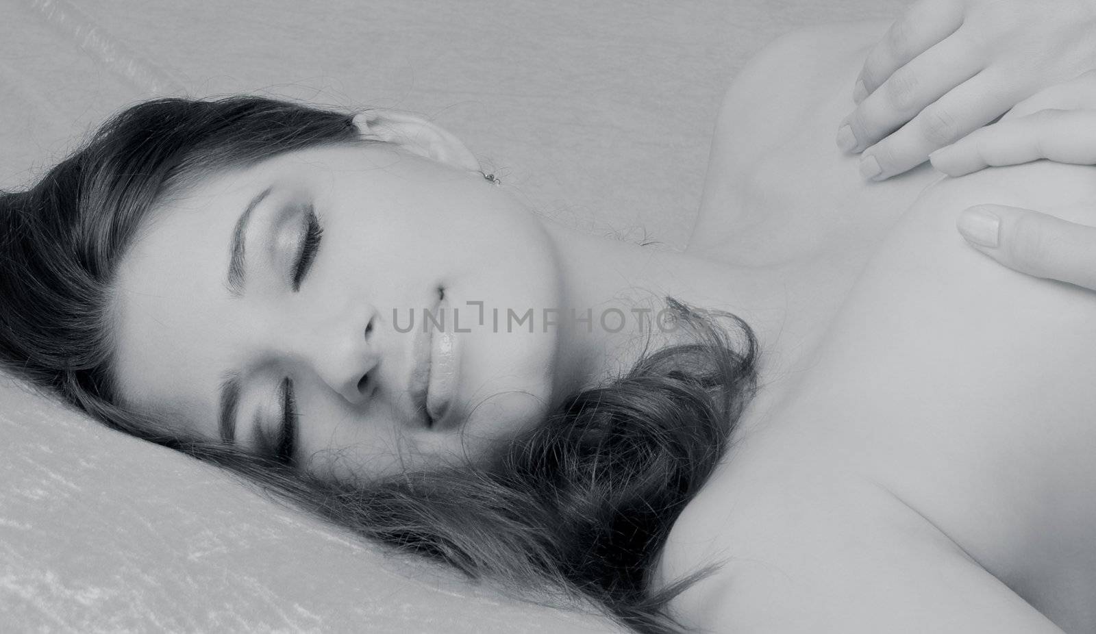 monochrome image of sleeping brunette with long hair