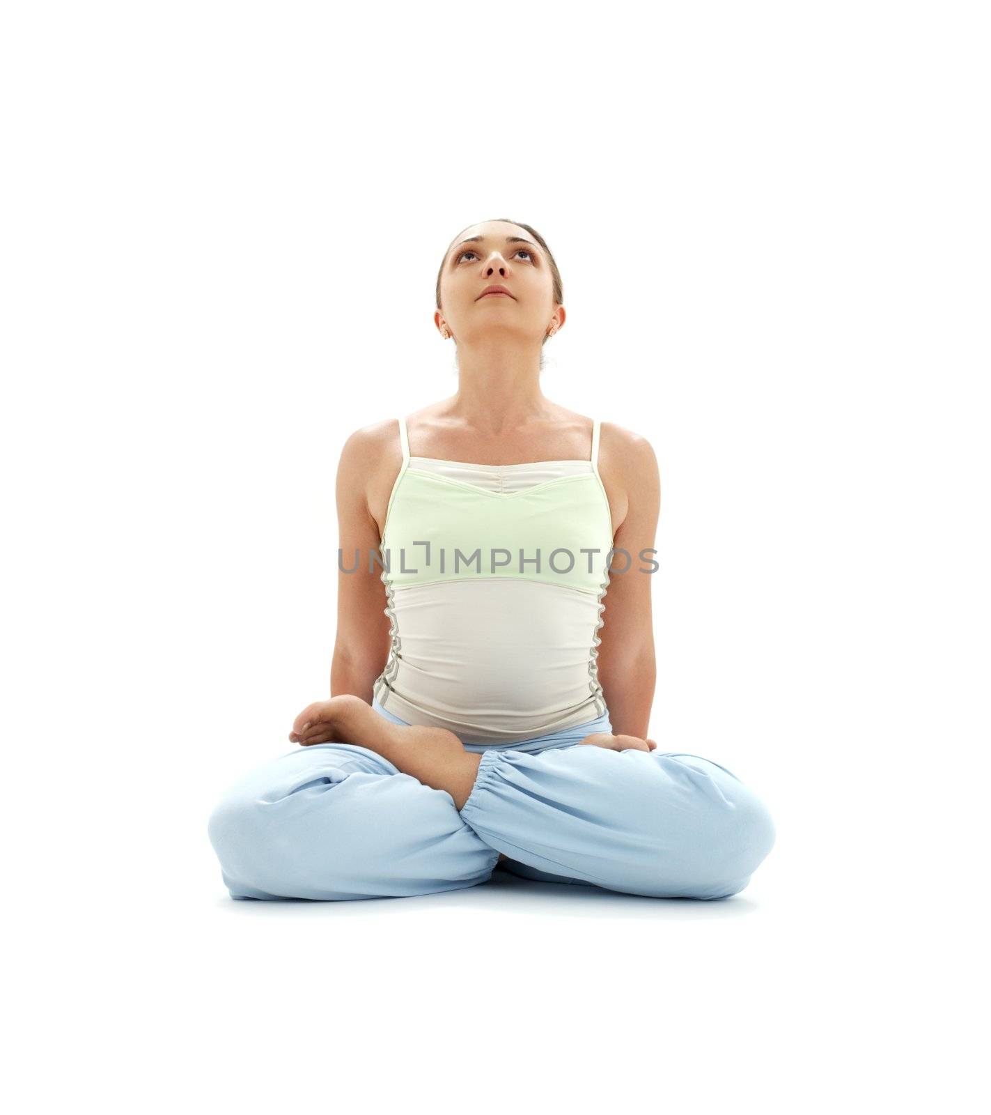 sporty girl practicing padmasana lotus pose over white