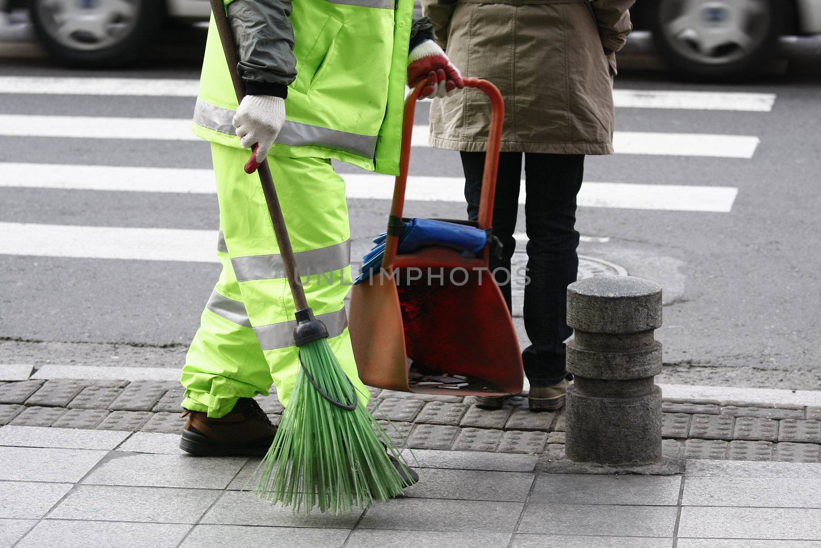street cleaner sweeping the road with a broom in Seoul Korea