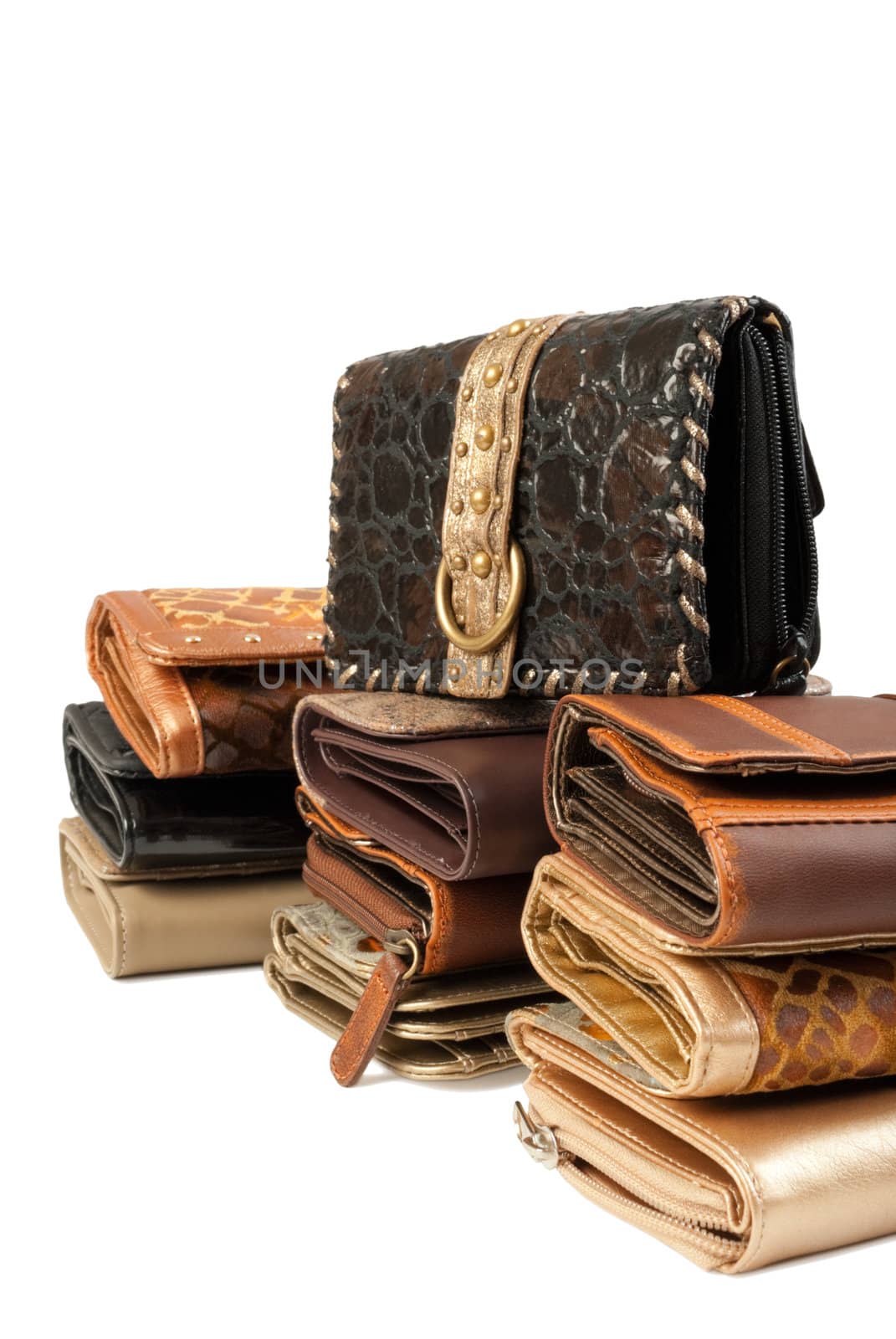 10 leather purses in stack. Isolated on white background
