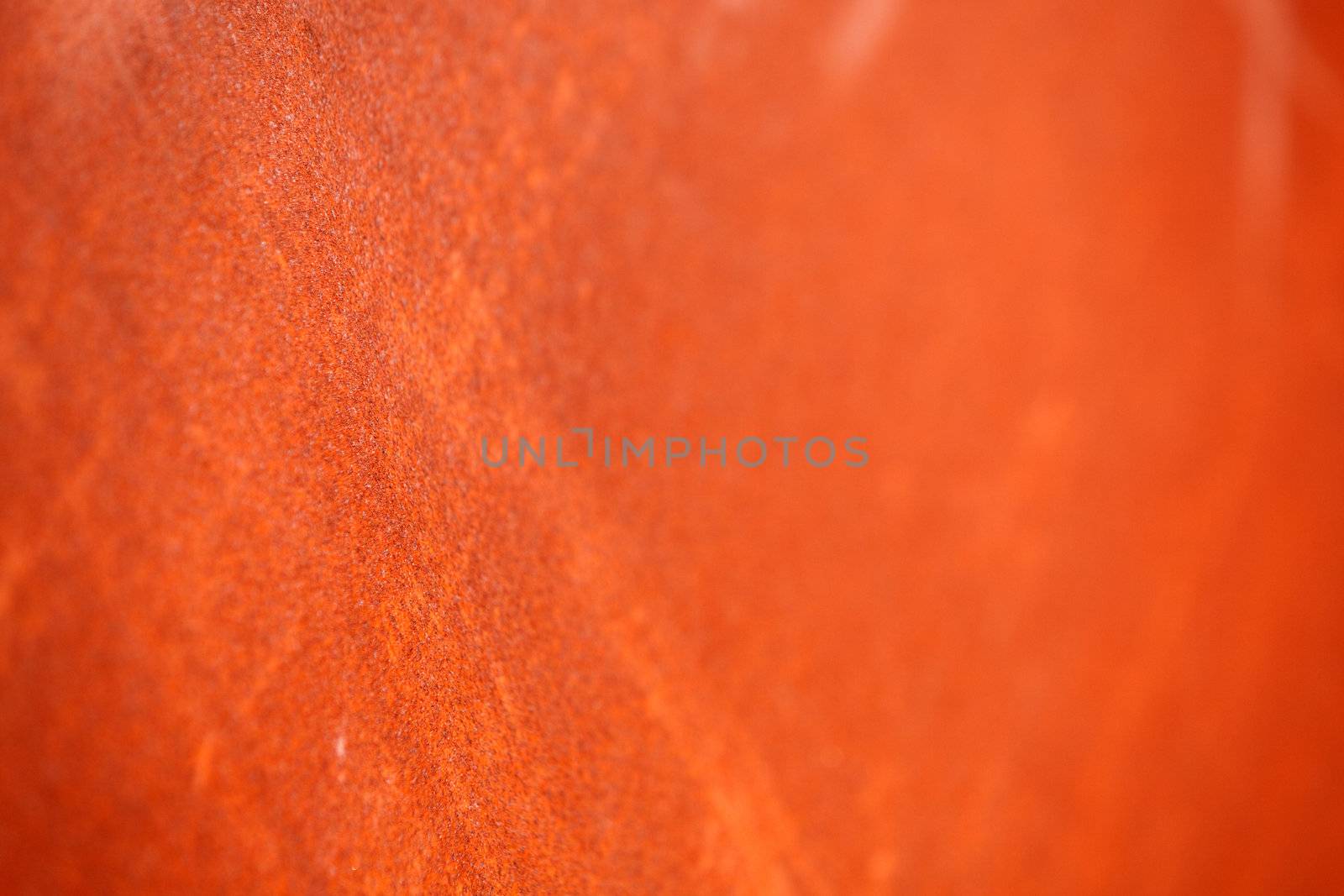 A rust background texture with very shallow depth of field