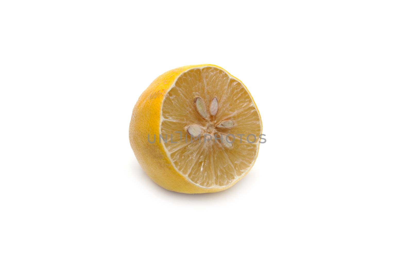 Half of the lemon, cut dry on white background
