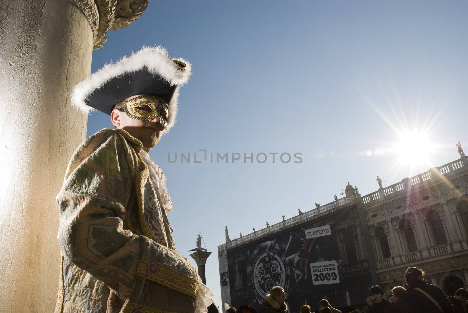 Traditionally dressed Venice carnival  male performer in Piazza San Marco, Italy