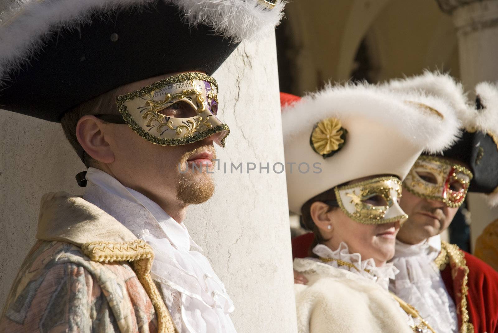 Traditionally dressed Venice carnival  female performers in Piazza San Marco, Italy