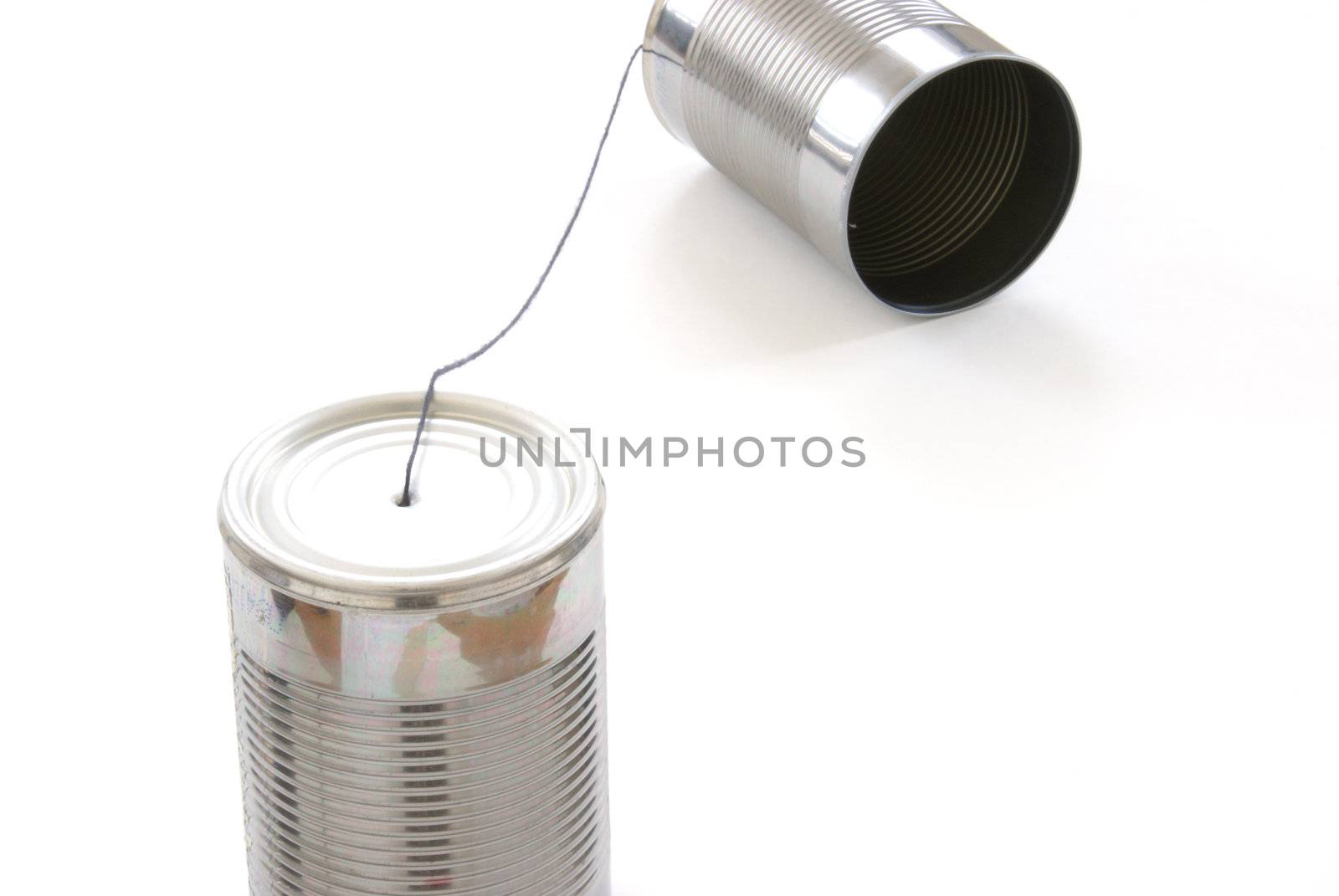 A homemade toy telephone out of tin cans and a string.