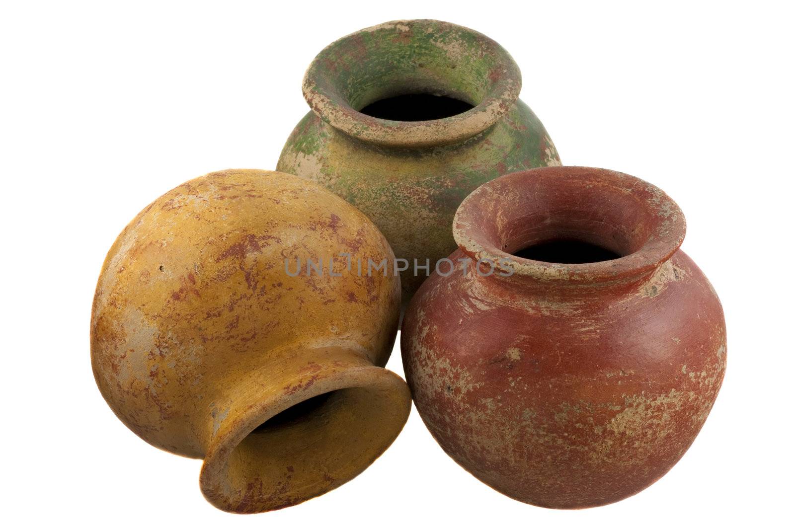 three, rough, red, green and yellow clay plant pots (mass produced planters) isolated on white