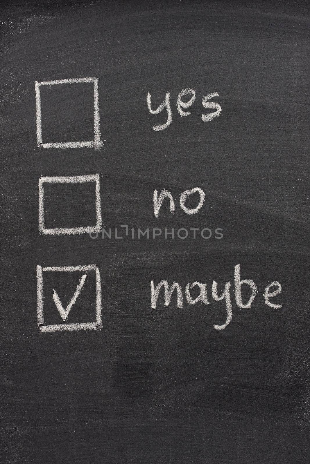 yes, no and maybe (checked) votting check boxes sketched with white chalk on blackboard, uncertainty or hesitation concept