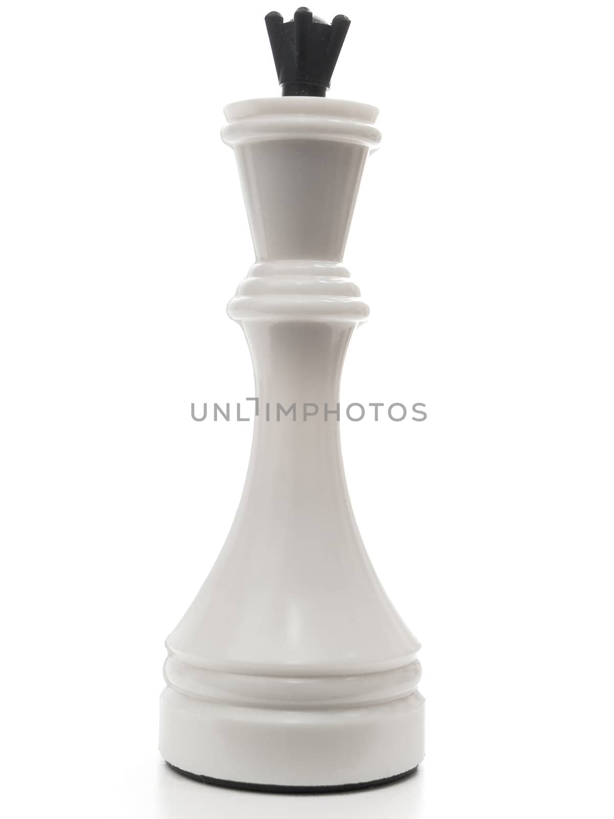 single white king in chess against the white background