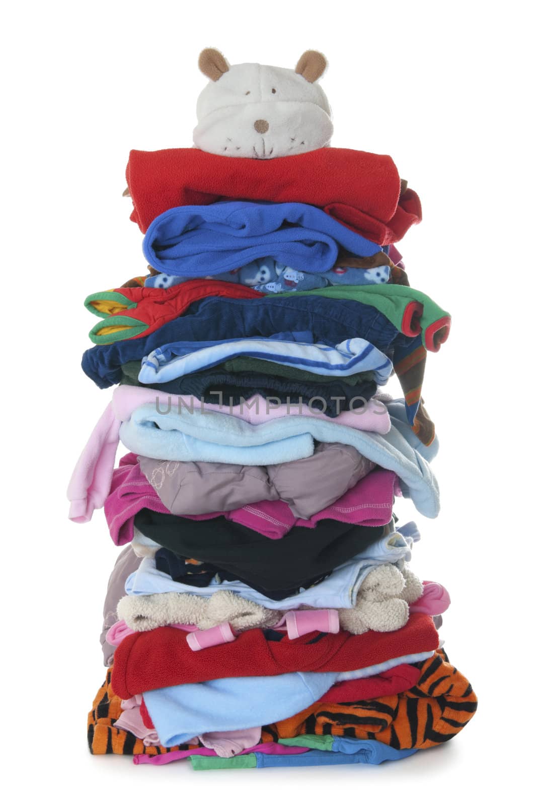 Pile of children's warm fluffy clothes | Isolated by zakaz