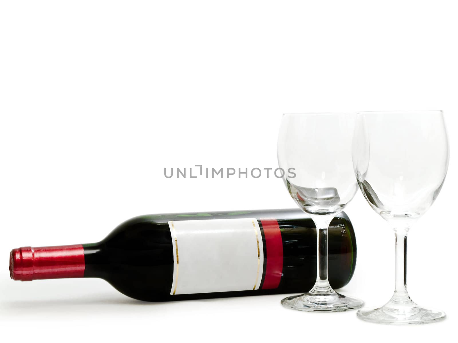  bottle of the red wine with wineglasses against the white background