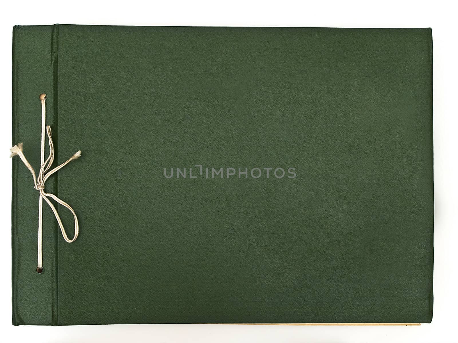 Old fashioned green album against the white background