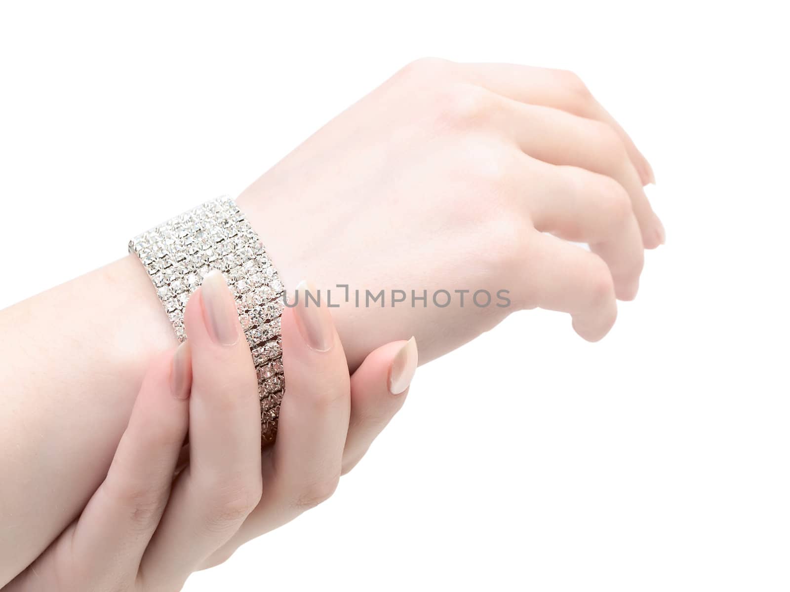 elegant bracelet at woman hand against the white background