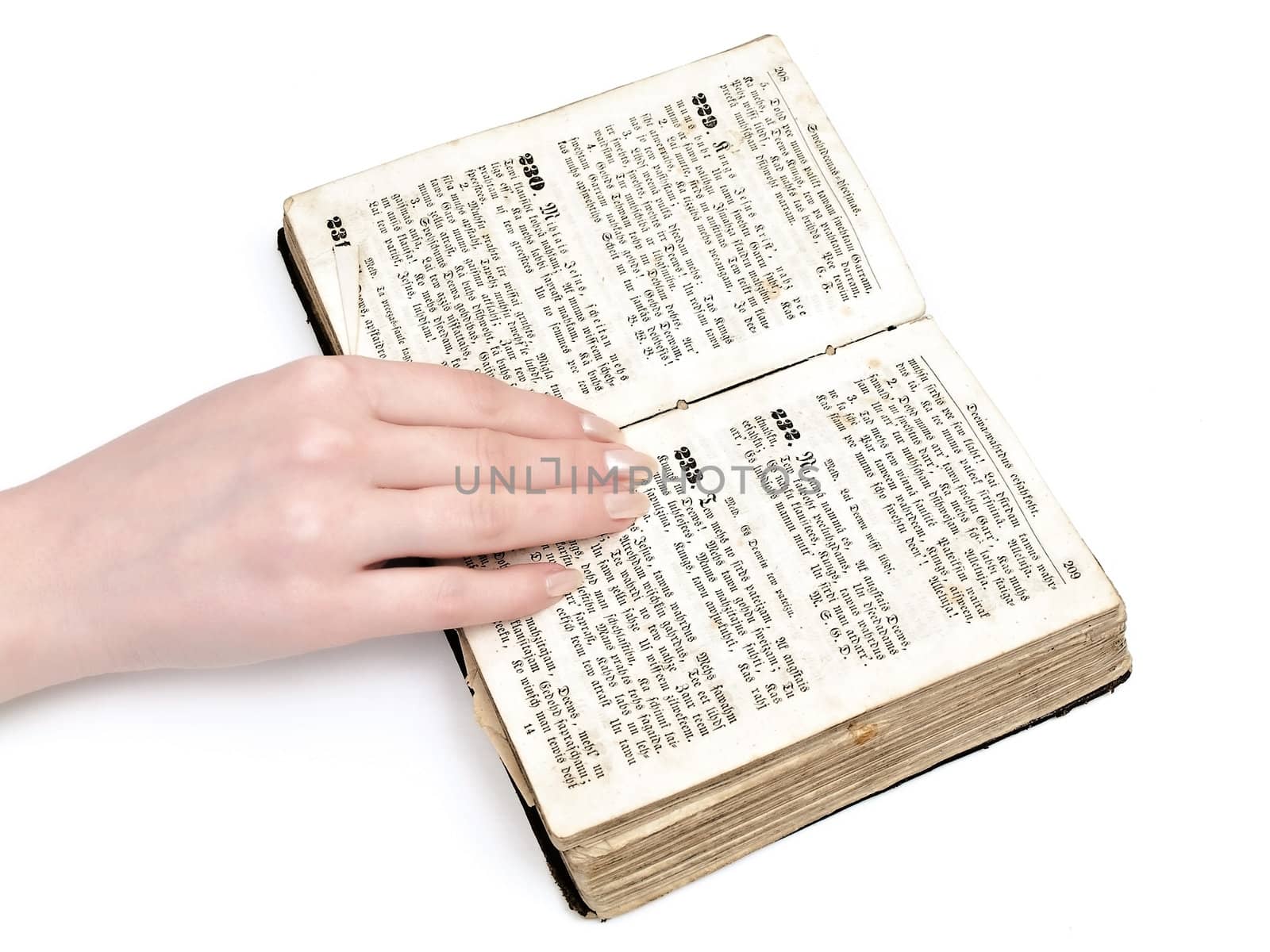 woman hand on old book against the white background