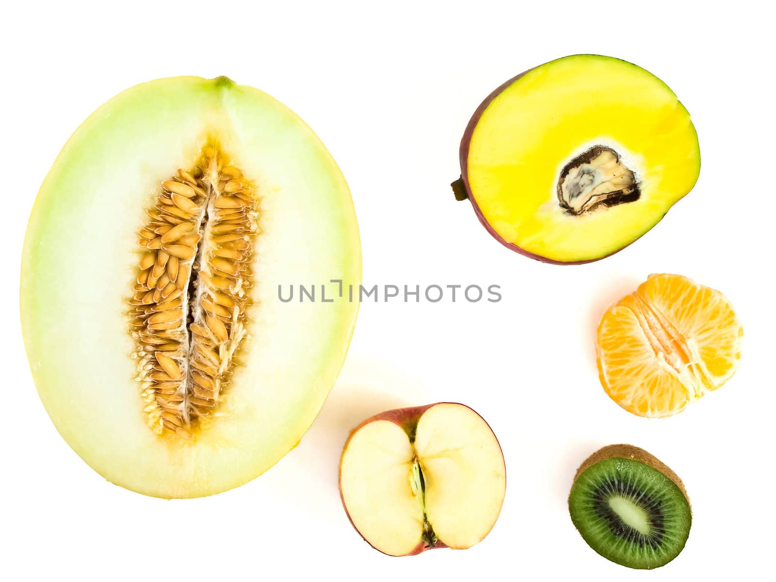 half of different fruits against white background