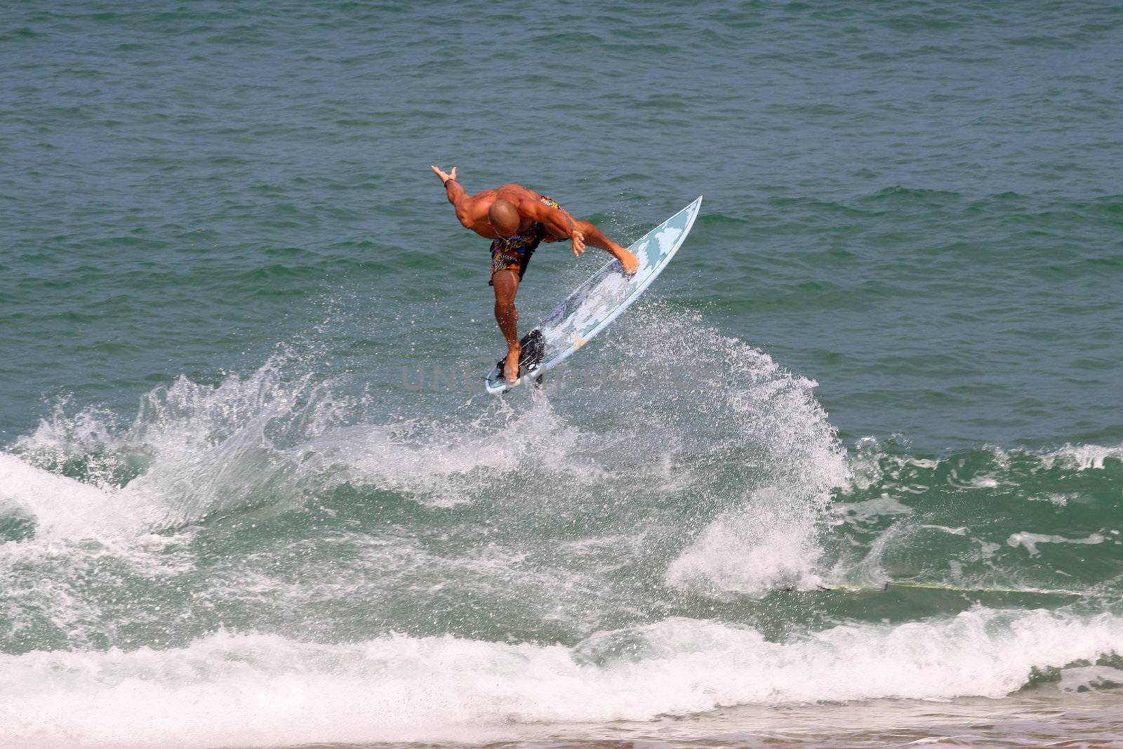 good surfer in action on a huge wave