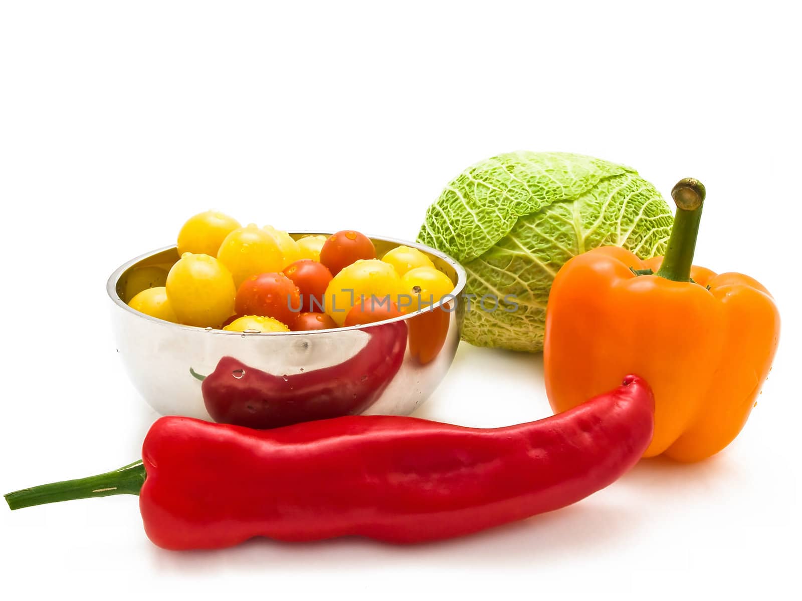 different multicolored vegetables over the white background