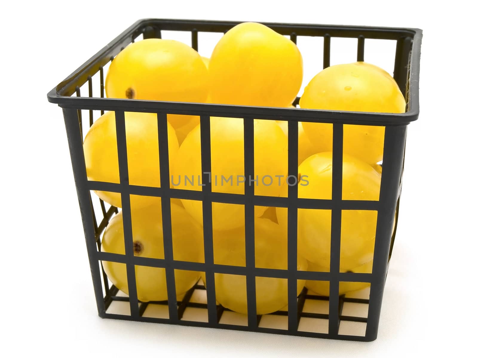 small yellow tomatoes over the white background