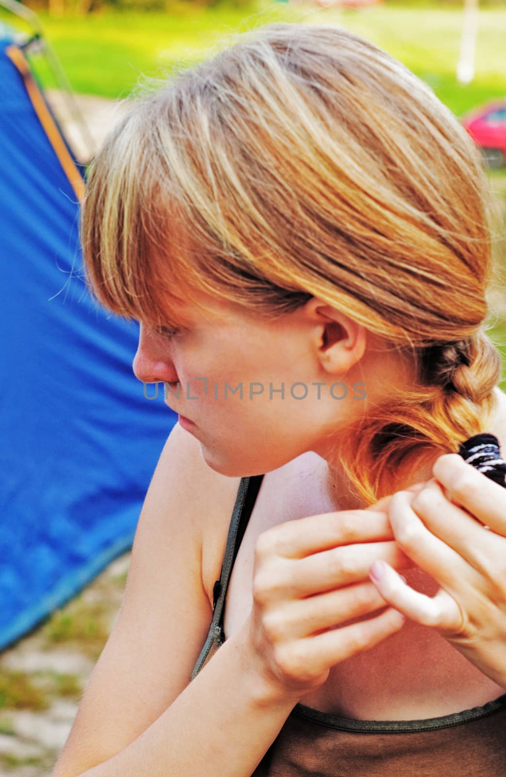 The girl with light hair straightens its