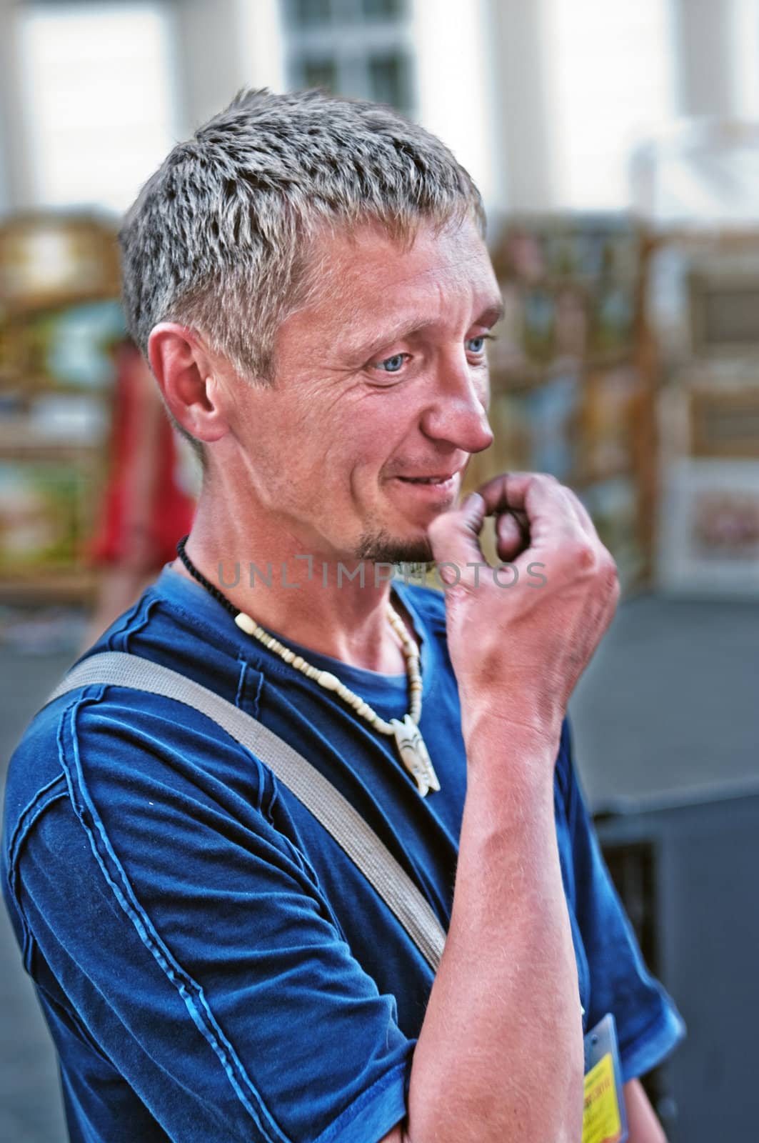 Portrait of the thoughtful smiling young man