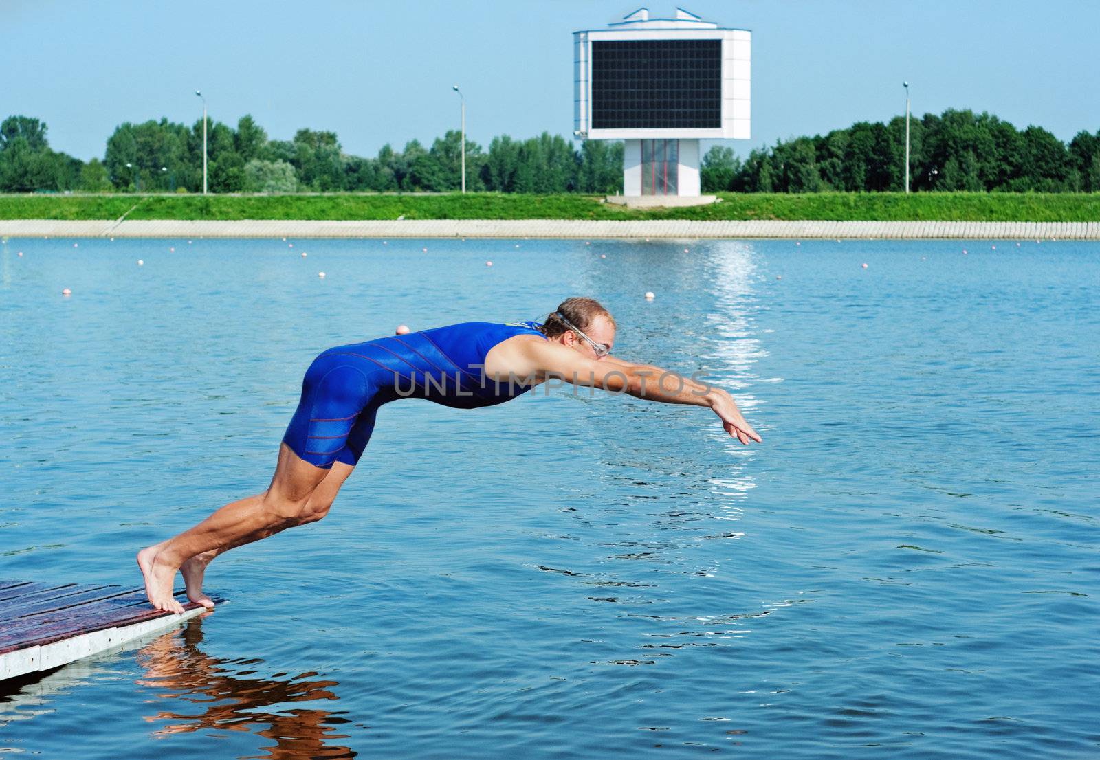 The sportsman jumps in water at competitions