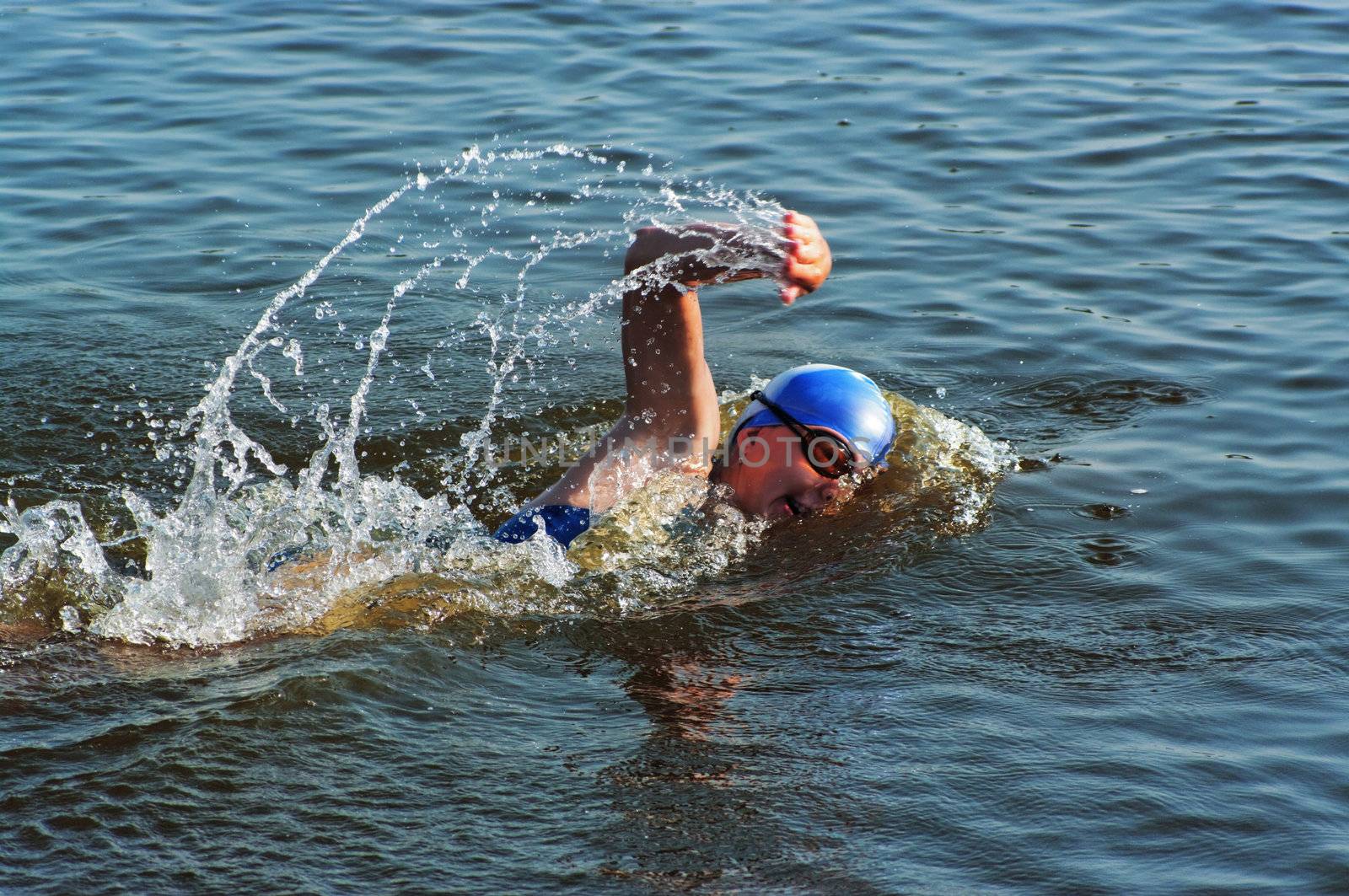 The sportswoman swim in water at competitions