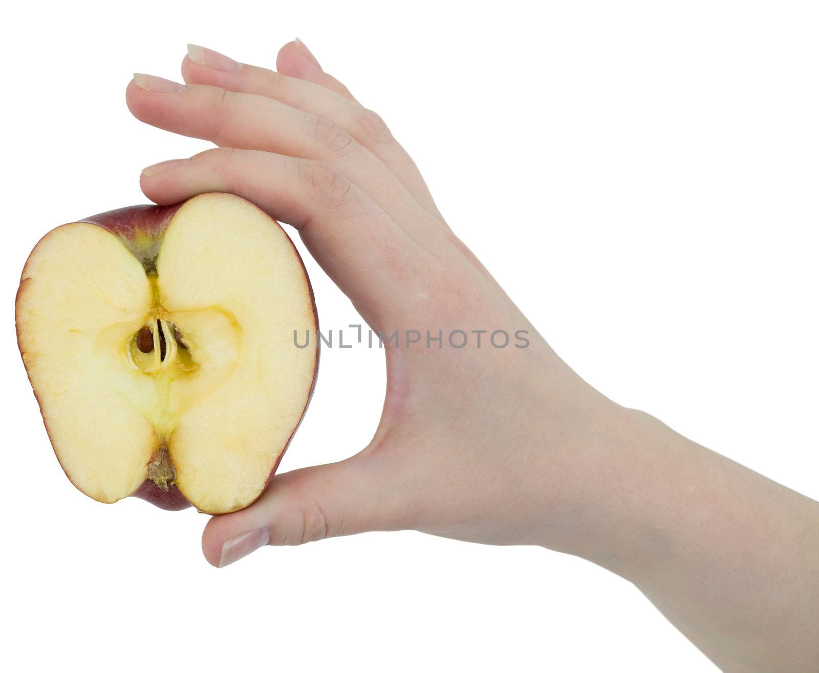 Cut apple in a female hand on white background