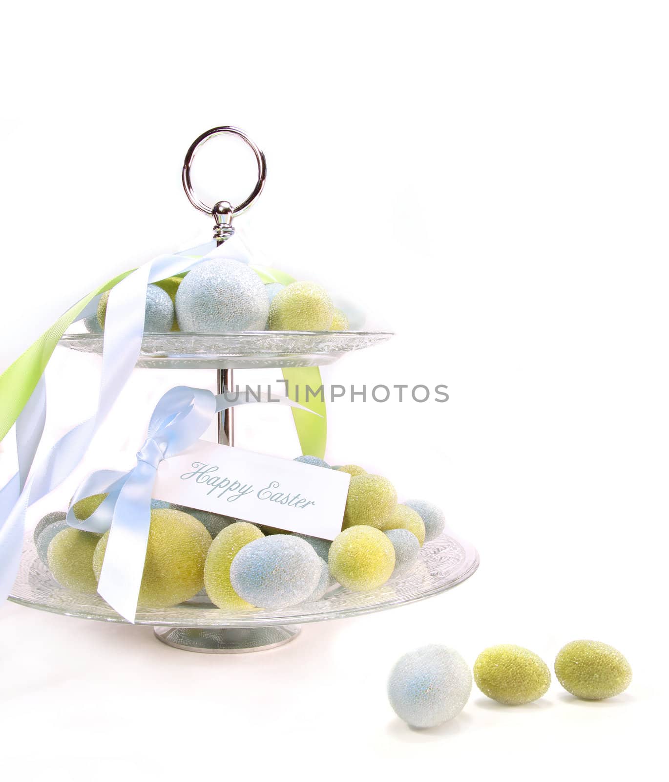 Colored beaded easter eggs on white background