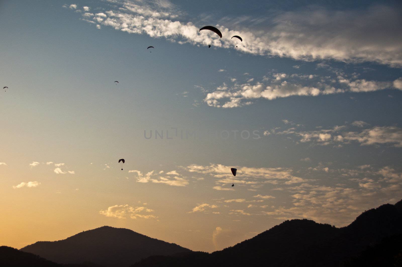 Numerous paragliders above Oludeniz, near Fethiye, Turkey, in great sunset light