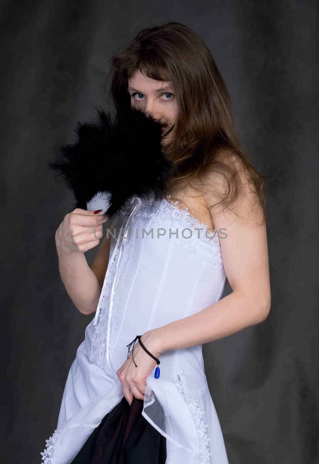 Portrait of the girl with a fan in hand