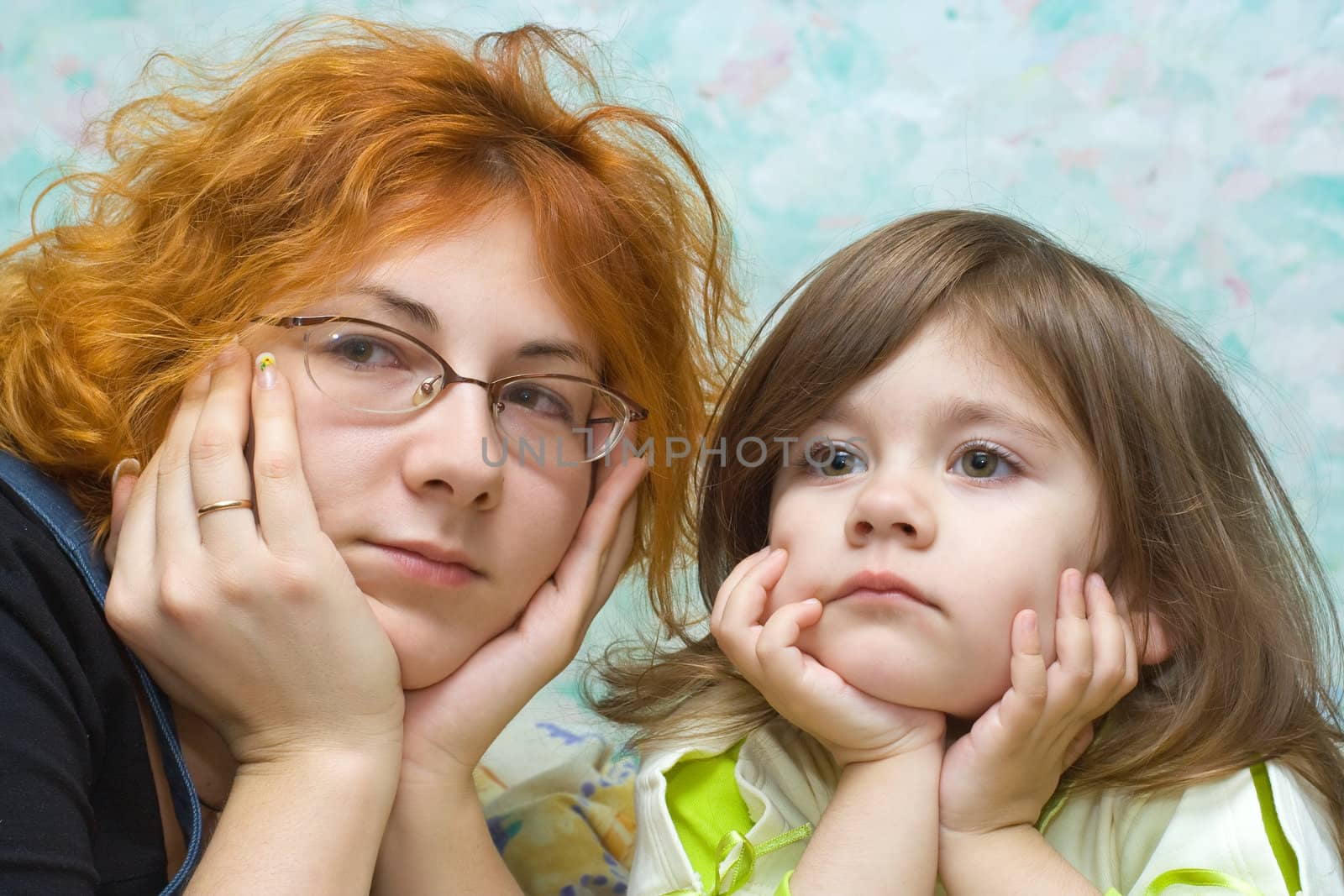 mother and daughter looking together in one direction