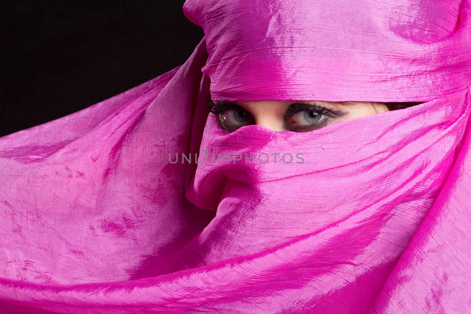 Arabian woman wearing pink headscarf