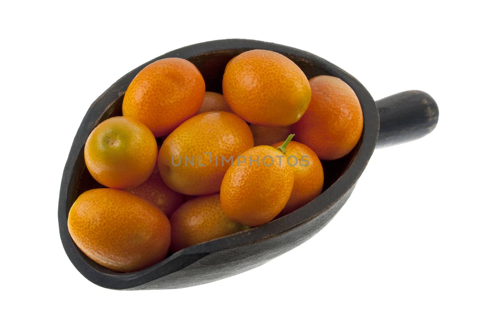 kumquats on a rustic, wooden scoop, isolated on white