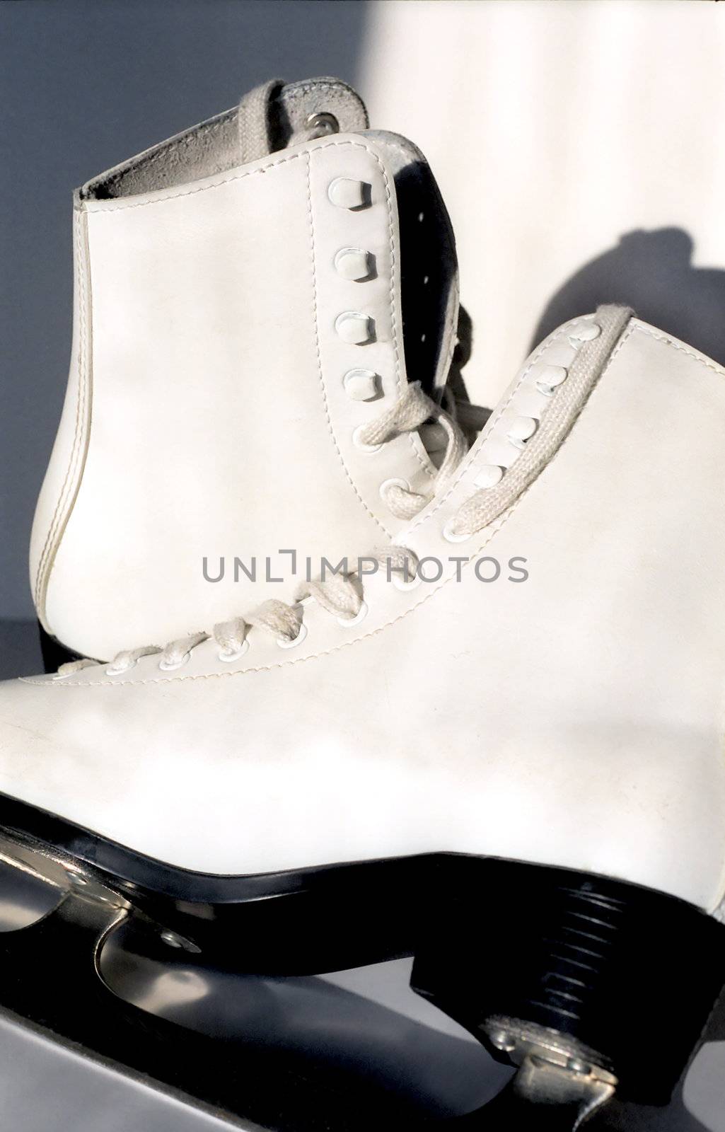 Pair of white ice skates by mulden