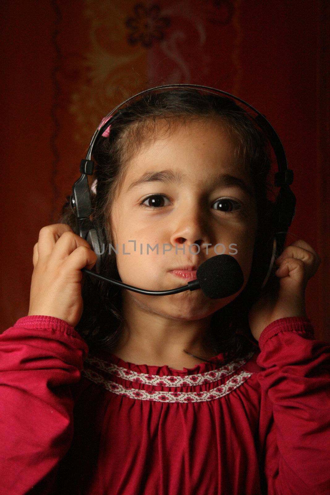 Smiling child wearing headset
