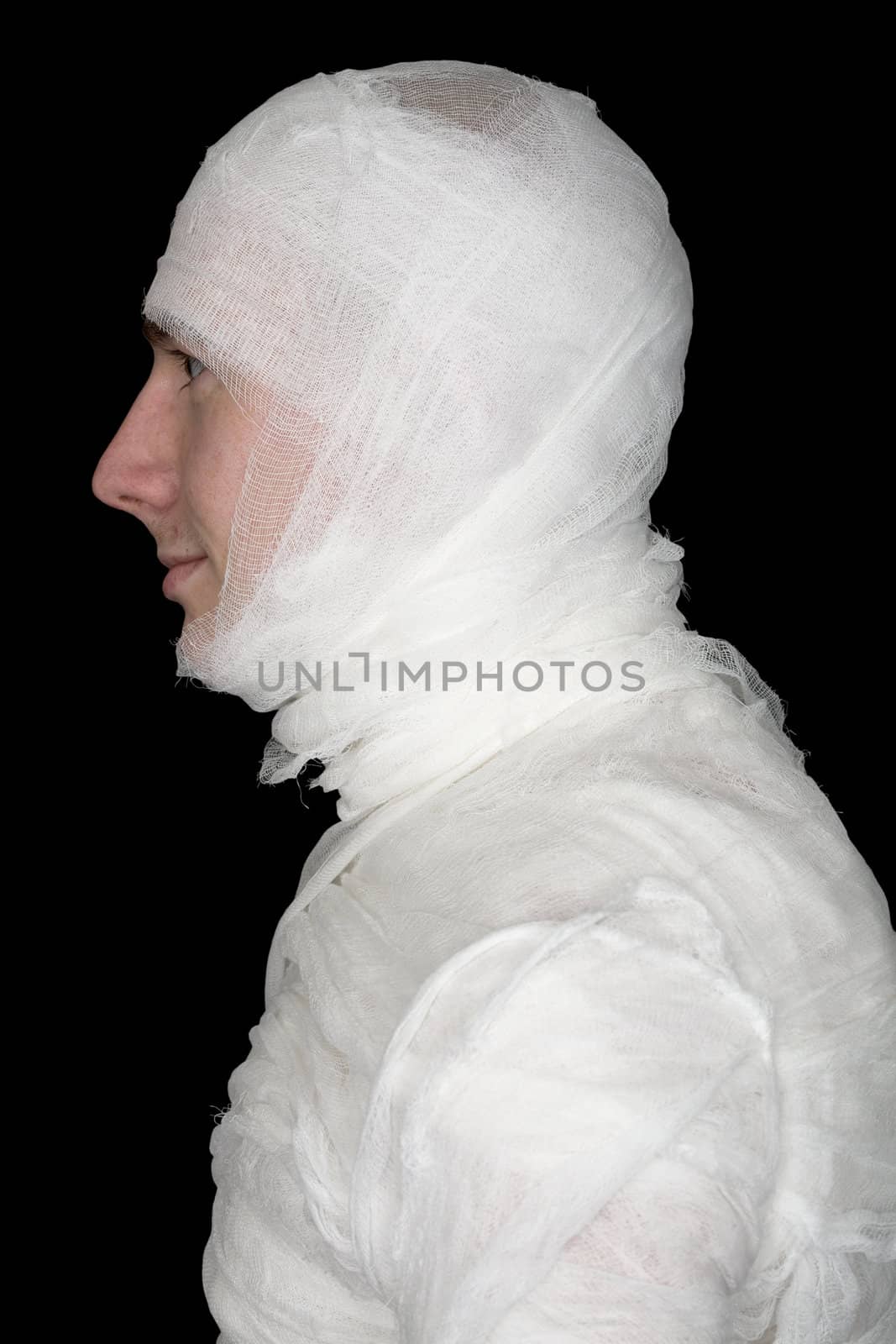 Man in bandage on the black background