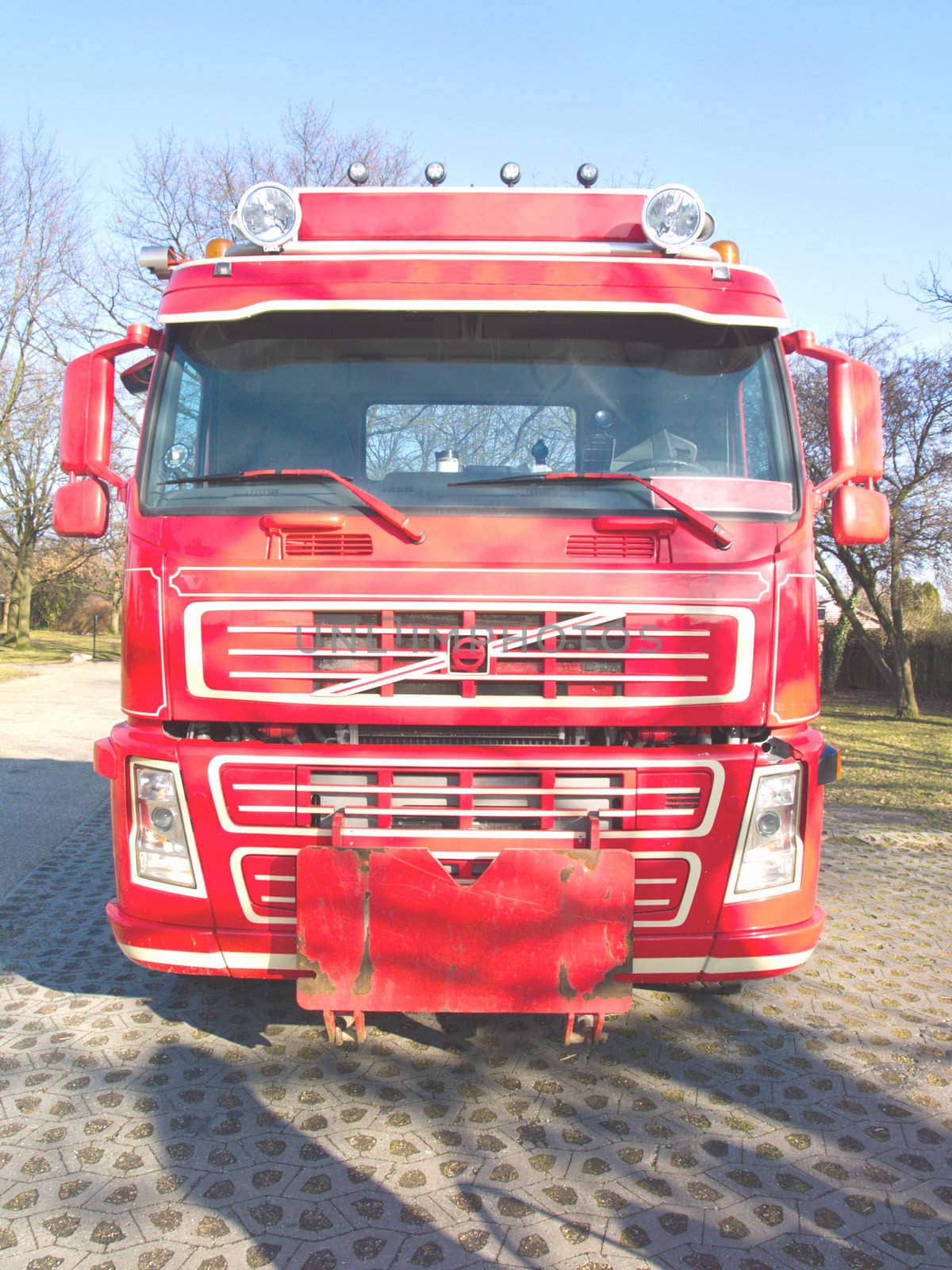 Front view of a red truck in urban  area