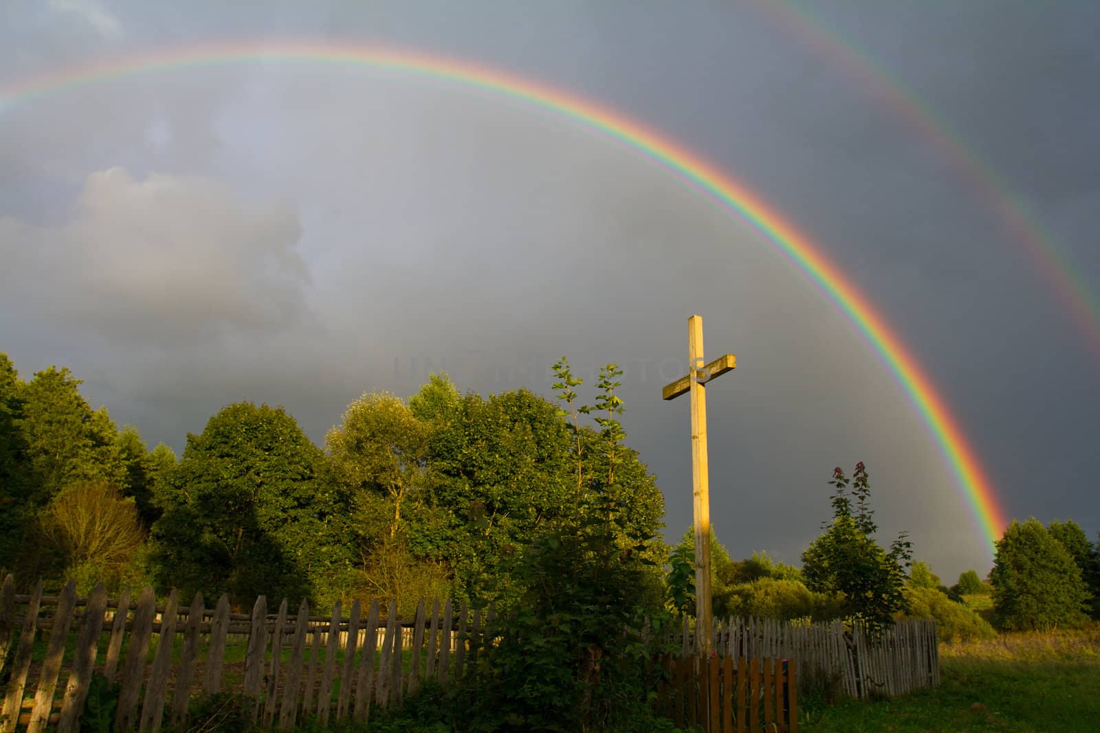 cross and rainbow after rain by Alekcey