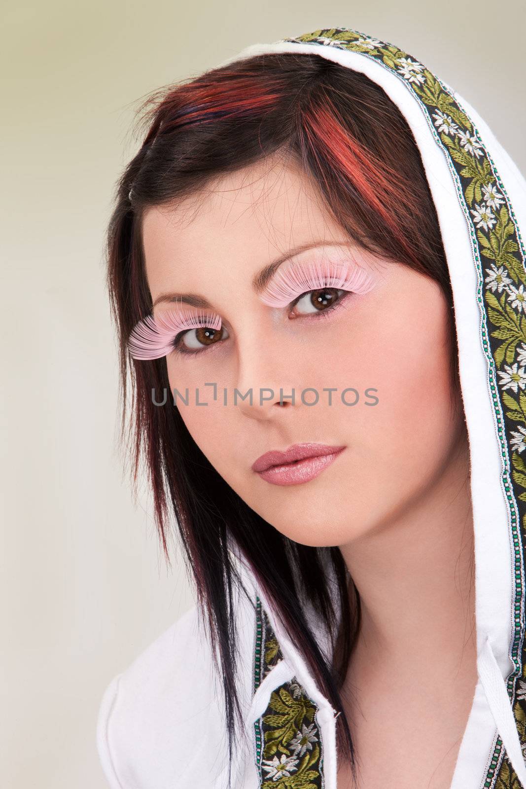 Portrait of young girl with faked lashes
