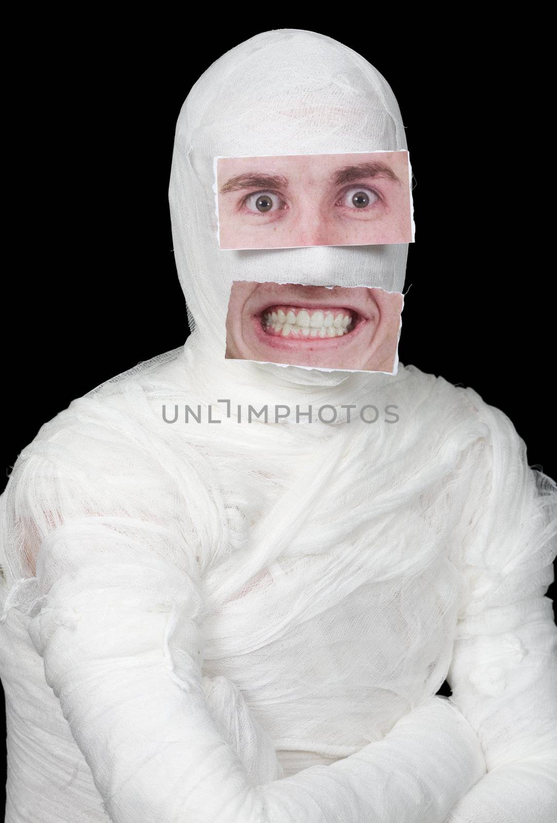 Bandaged man with false paper face on black