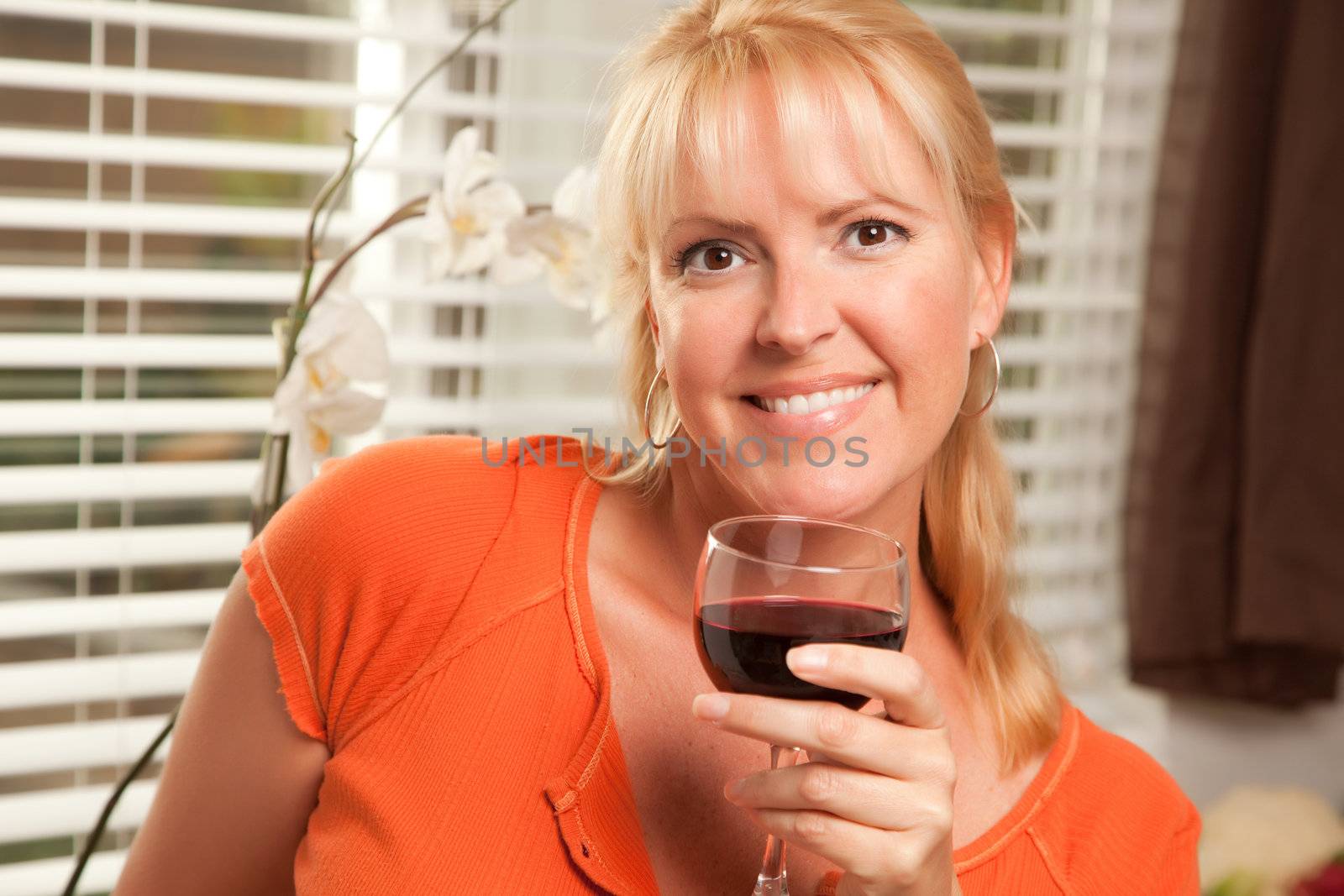 Attractive Blond with a Glass of Wine by Feverpitched