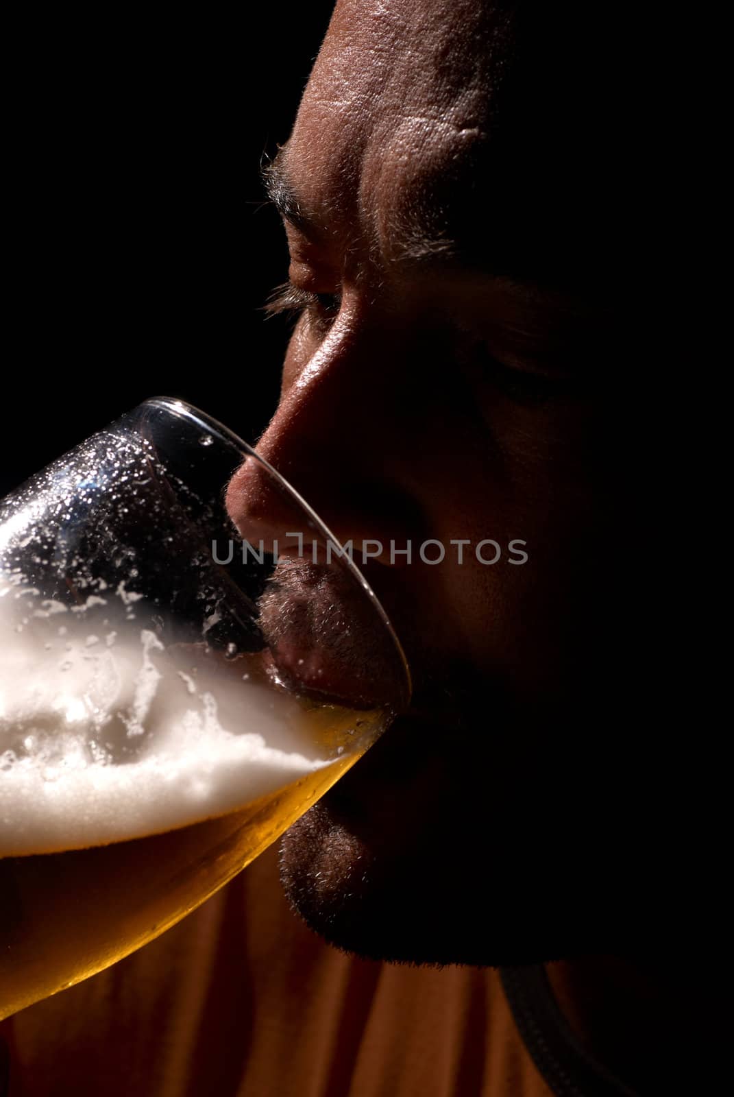 Guy enjoying is cold pint after a hot day
