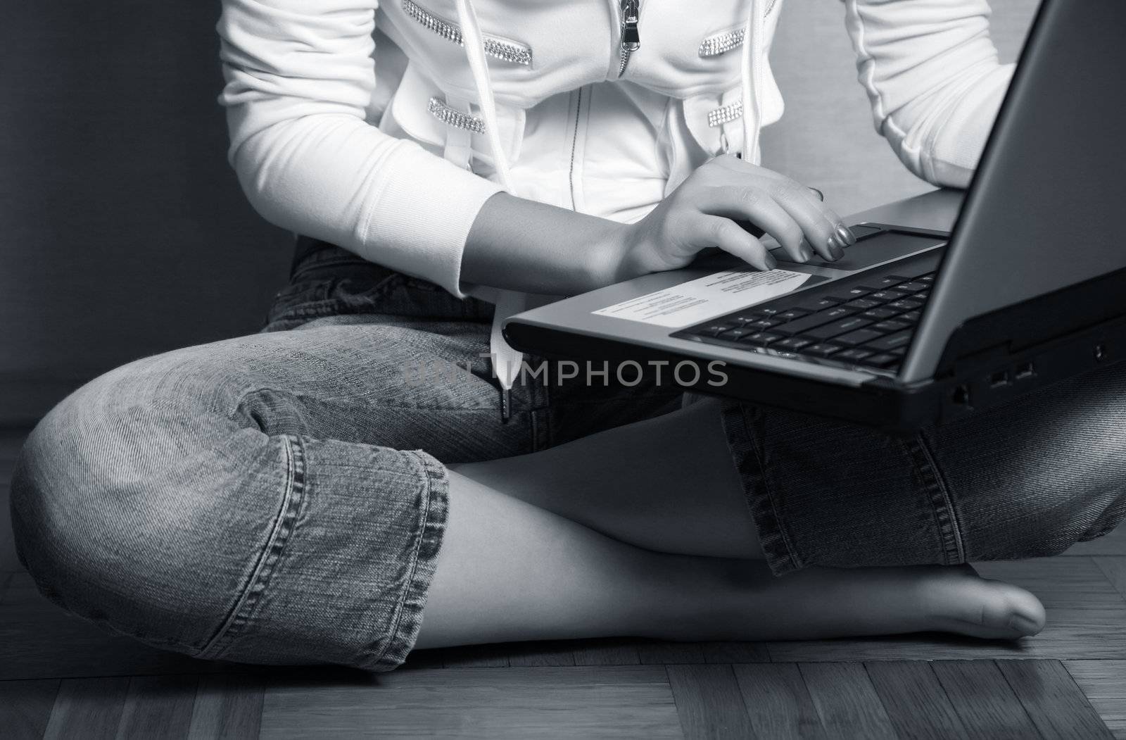 Computer in a lap the young girl