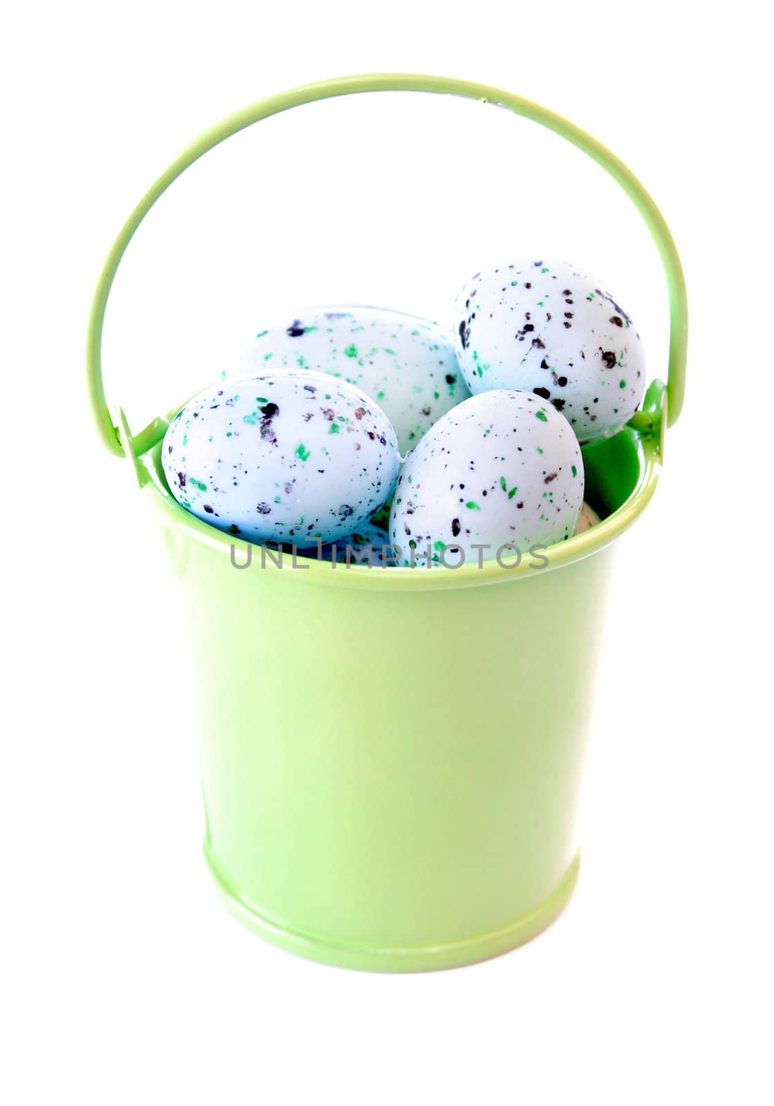 Lime green bucket full of Easter eggs isolated on a white background.