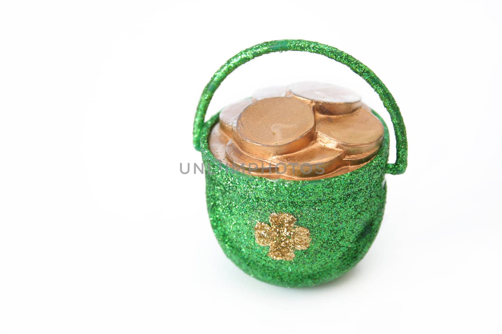 A pot of gold covered in glitter and isolated on a white background.