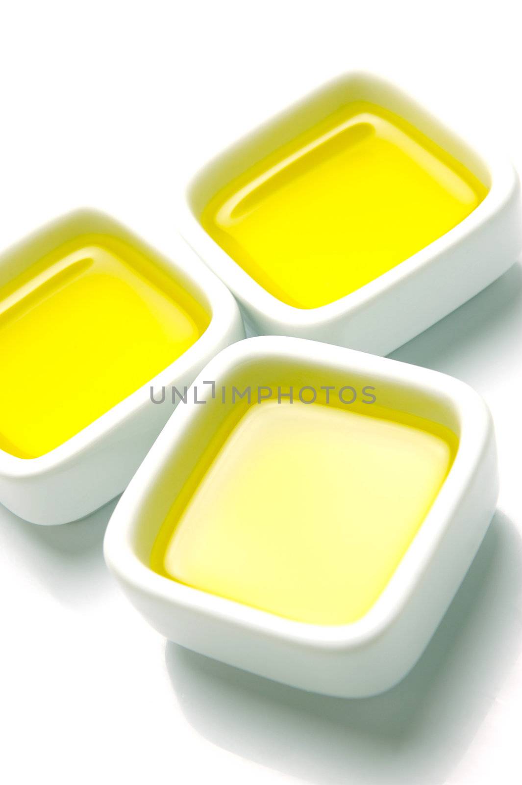 Olive Oil in small serving bowls isolated against a white background