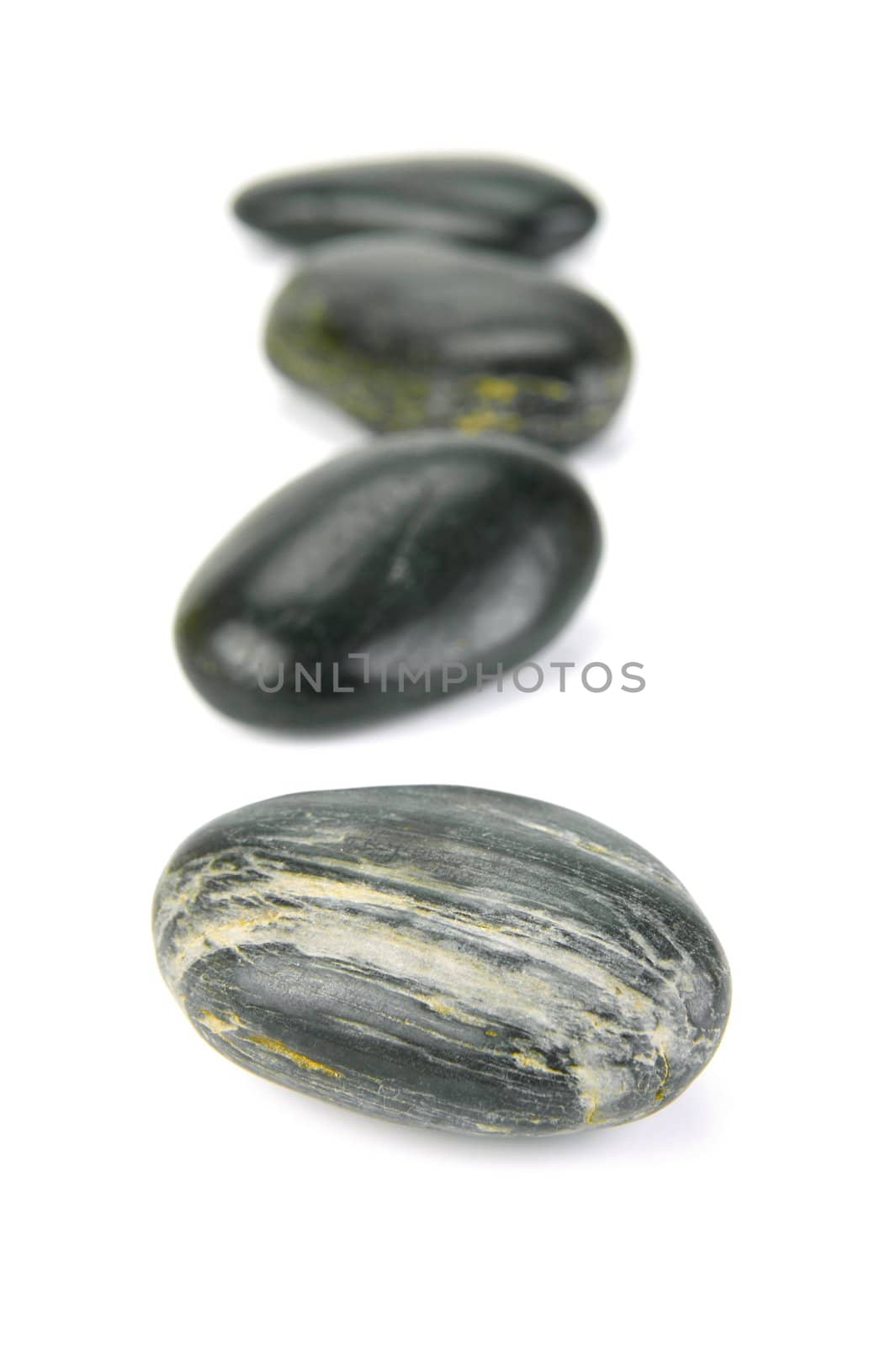 Black river rocks isolated against a white background