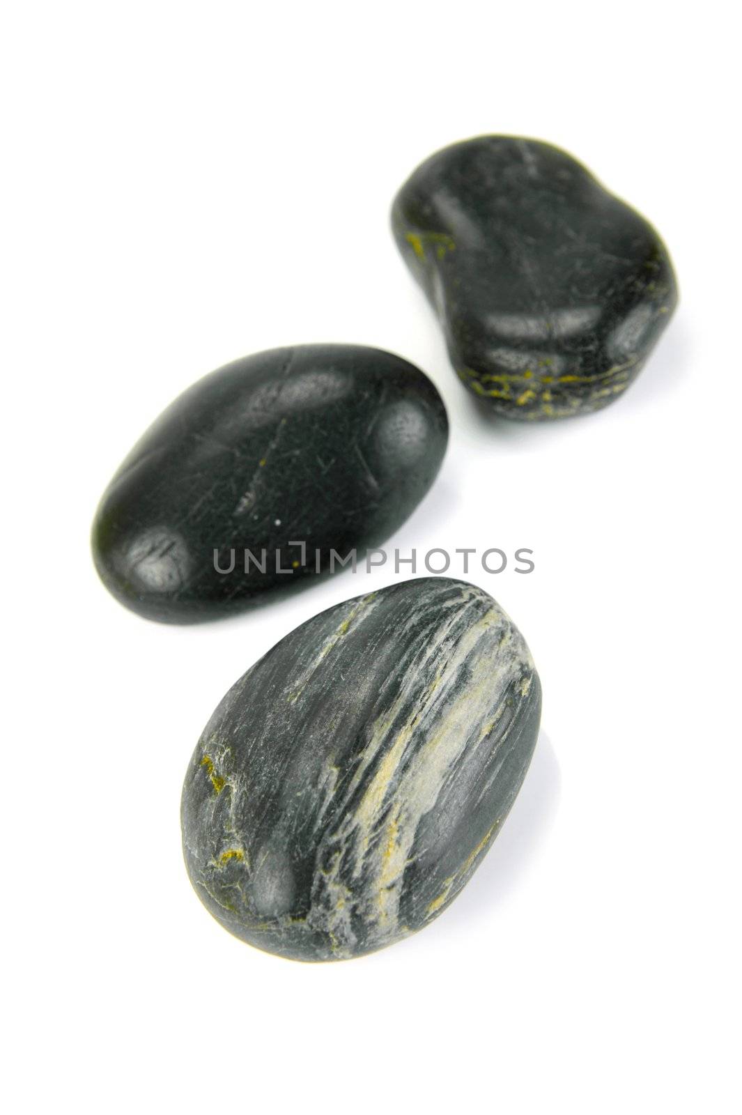 Black river rocks isolated against a white background