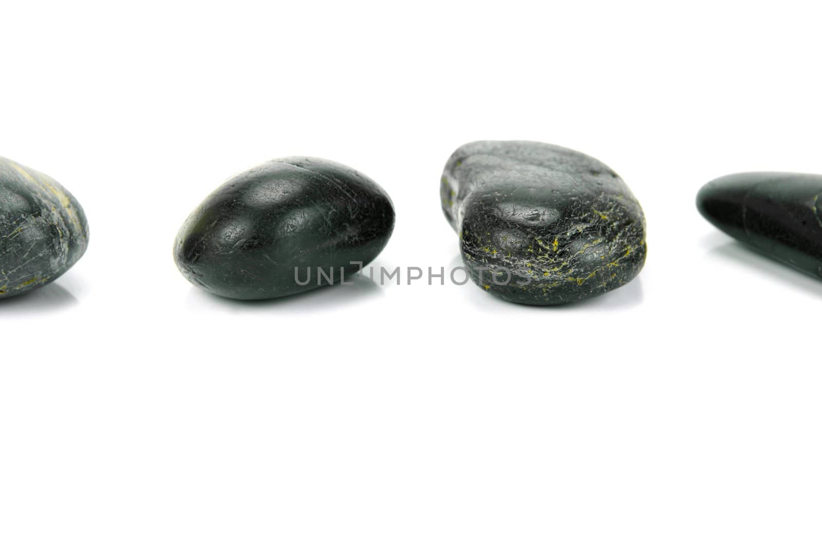 Black river rocks isolated against a white background