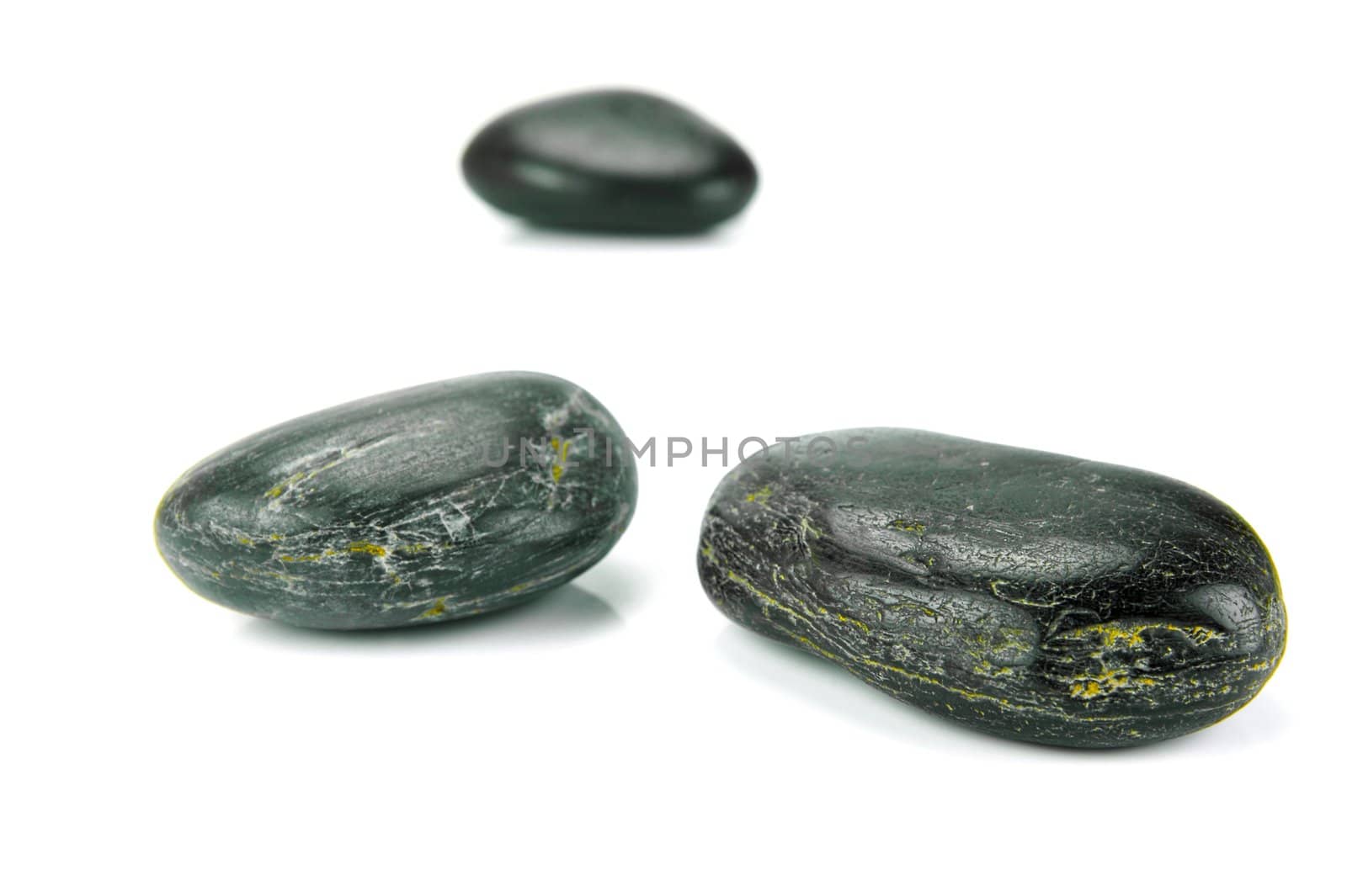 Black river rocks isolated against a white background